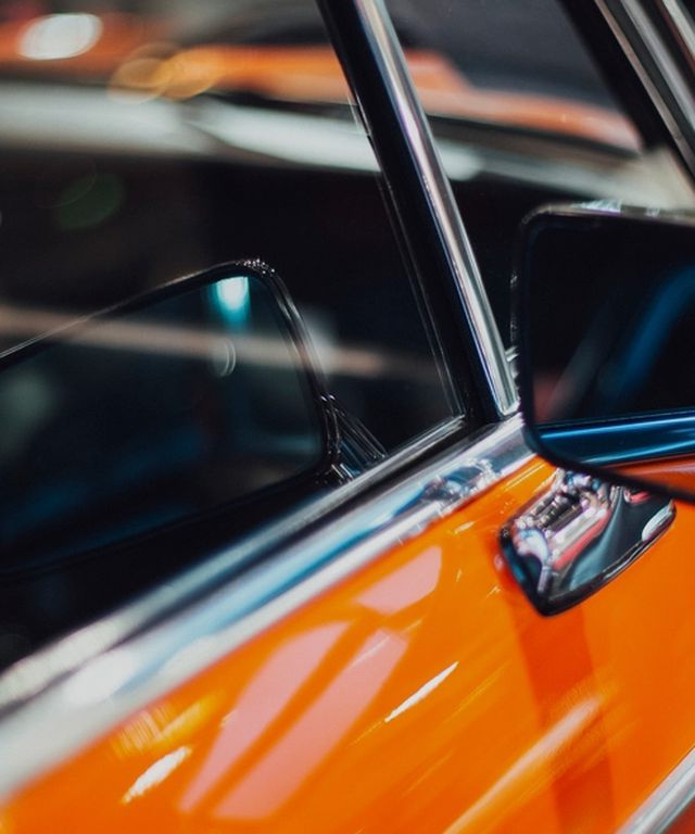 Close-up of a car side window with dark tinted glass