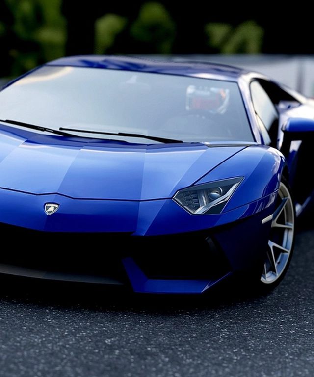 Deep-blue vinyl-wrapped supercar with a glossy finish